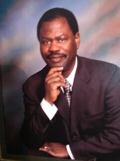 A man in suit and tie posing for the camera.